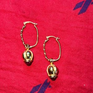 Beautiful pair of oval hoops with a hanging charm